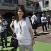 Marion Jollès-Grosjean, enceinte et radieuse dans les allées du paddock du Grand Prix de Formule 1 du dimanche 26 mai 2013