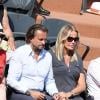 Henri Leconte et sa femme Florentine lors de la demi-finale homme entre Rafael Nadal et Novak Djokovic, Jo-Wilfried Tsonga et David Ferrer aux Internationaux de tennis de Roland-Garros à Paris, le 7 juin 2013.