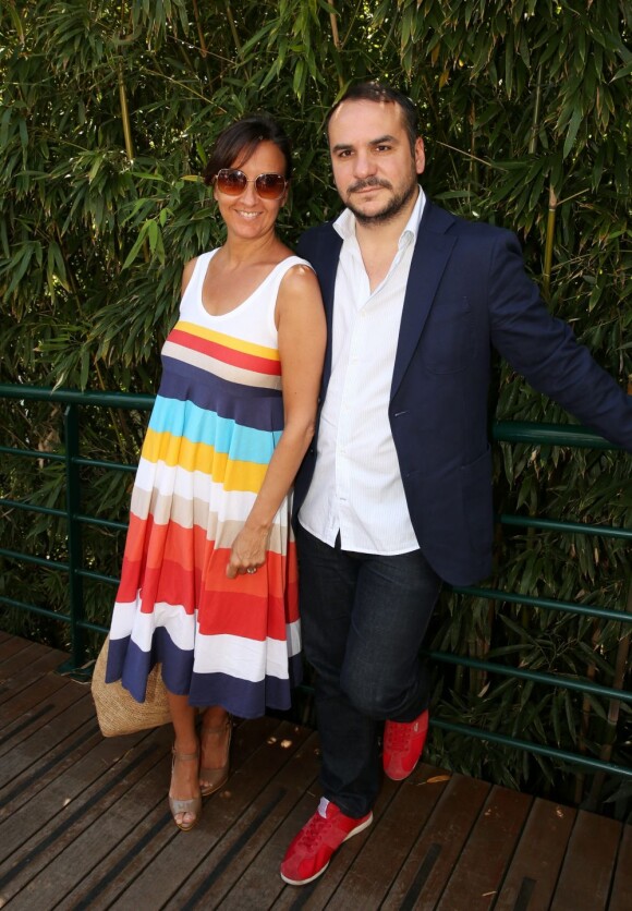 Francois-Xavier Demaison et sa femme Emmanuelle lors des Internationaux de tennis de Roland-Garros, le 7 juin 2013.