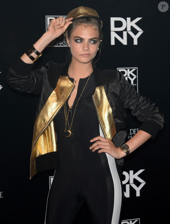 Cara Delevingne assiste à la soirée de lancement de DKNY ArtWorks à la Lambeth Fire Station. Londres, le 12 juin 2013.