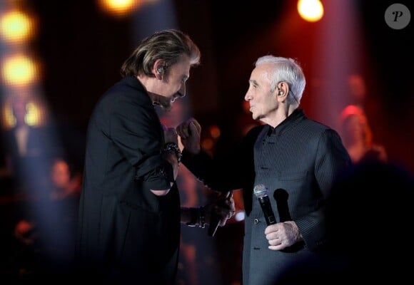 Johnny Hallyday et Charles Aznavour à Paris le 11 janvier 2013.