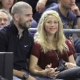 Shakira et son compagnon Gerard Piqué, très amoureux lors du match de basket-ball entre Barcelone et Panathinaikos à Barcelone, le 25 avril 2013.
