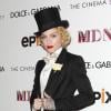 Madonna en smoking Dolce & Gabbana lors de l'avant-première  Madonna: The MDNA Tour au cinéma Paris. New York, le 18 juin 2013.