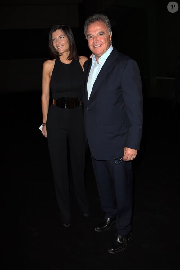 Alain Afflelou et sa femme Christine au défilé de mode haute couture automne-hiver 2013-2014 "Stéphane Rolland" au Tennis Club à Paris, le 2 juillet 2013.