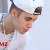 Justin Bieber en train de cracher du haut de son hôtel à Toronto... alors que ses fans l'attendent en bas.