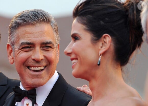 Sandra Bullock et George Clooney radieux et complices pour la cérémonie d'ouverture et la présentation de Gravity à la 70e Mostra de Venise, le 28 août 2013.