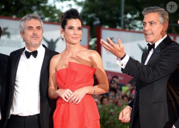 Sandra Bullock et George Clooney avec Alfonso Cuaron à la cérémonie d'ouverture et la présentation de Gravity à la 70e Mostra de Venise, le 28 août 2013.