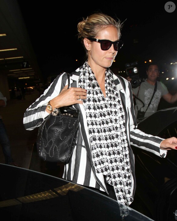 Heidi Klum arrive a l'aéroport à Los Angeles. Le 30 août 2013.