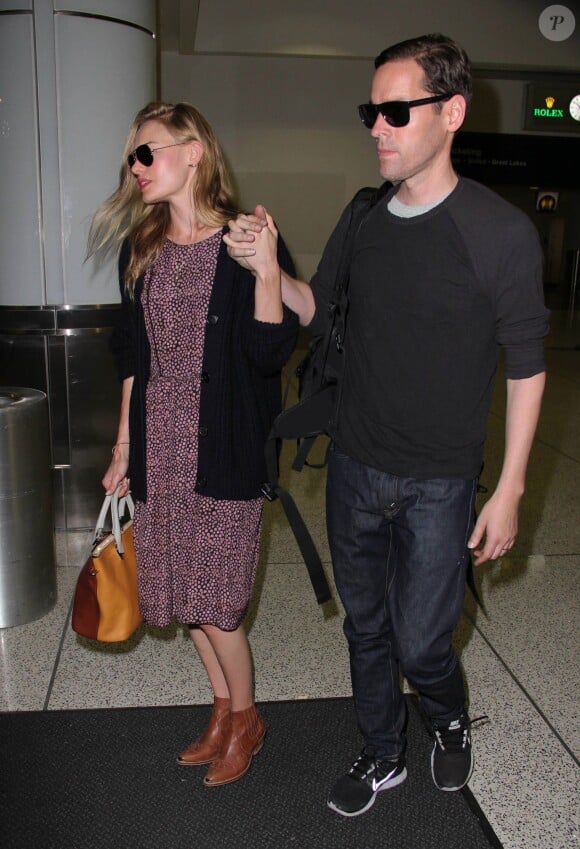 Kate Bosworth et son mari Michael Polish arrivent à l'aéroport LAX de Los Angeles par un vol en provenance du Montana, le 2 septembre 2013.