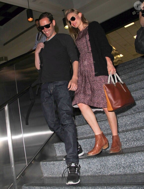 Kate Bosworth et son mari depuis peu, Michael Polish, arrivent à l'aéroport LAX de Los Angeles par un vol en provenance du Montana, le 2 septembre 2013.
