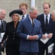  Abattu, le prince Charles disait adieu le 11 septembre 2013 à son grand ami Hugh van Cutsem, entouré de son épouse Camilla et ses fils Harry et William, à Brentwood dans l'Essex. 