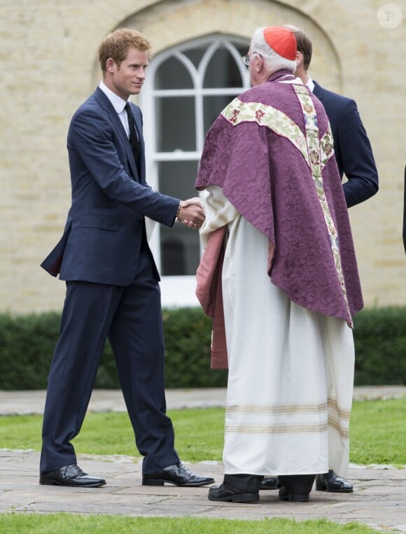 Le prince Harry et le prince William lors de la messe des obsèques de Hugh van Cutsem, le 11 septembre 2013 à la cathédrale de Brentwood, dans l'Essex.