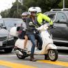 Exclusive - Gwyneth Paltrow and her husband Chris Martin take their little ones Apple and Moses to school. The couple drove side-by-side on their Vespas with their kids behind them and stopped at a busy intersection. Los Angeles, CA, USA, September 11, 2013. Photo by GSI/ABACAPRESS.COM12/09/2013 - Los Angeles