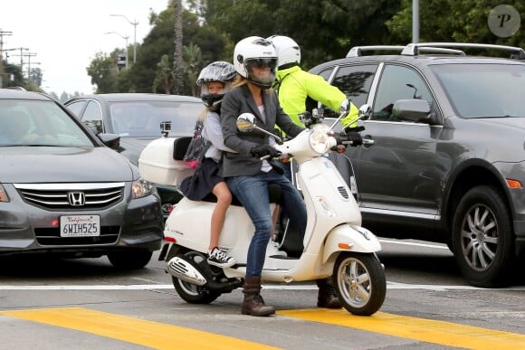 Exclusive - Gwyneth Paltrow and her husband Chris Martin take their little ones Apple and Moses to school. The couple drove side-by-side on their Vespas with their kids behind them and stopped at a busy intersection. Los Angeles, CA, USA, September 11, 2013. Photo by GSI/ABACAPRESS.COM12/09/2013 - Los Angeles