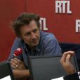 Olivier Caillart, directeur général du label Barclay, défend la sortie du nouvel album de Betrand Cantat sur RTL, au micro de Marc-Olivier Fogiel, le 30 septembre 2013.