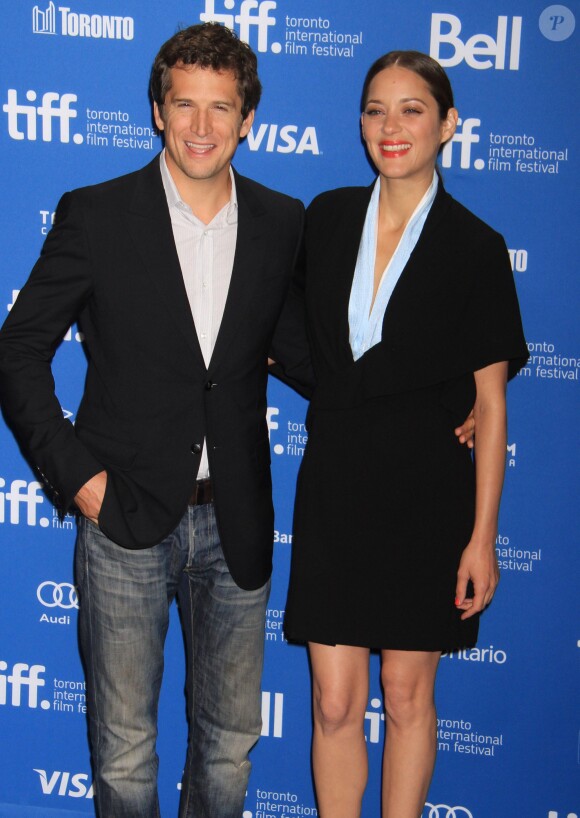 Guillaume Canet et Marion Cotillard lors du photocall du film "Blood Ties" au festival du Film de Toronto le 10 septembre 2013