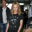 Kylie Minogue arrive à l'aéroport d'Heathrow à Londres, le 13 septembre 2013.