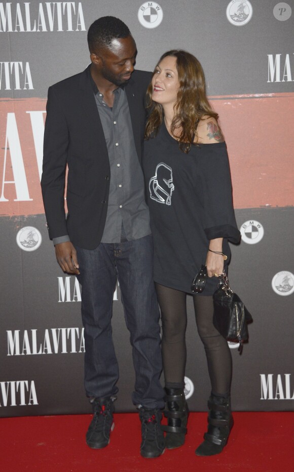 Thomas Ngijol et Karole Rocher lors de l'avant-première du film "Malavita" au Cinéma Europacorp inauguré dans le centre commercial Aéroville autour de Roissy, le 16 octobre 2013