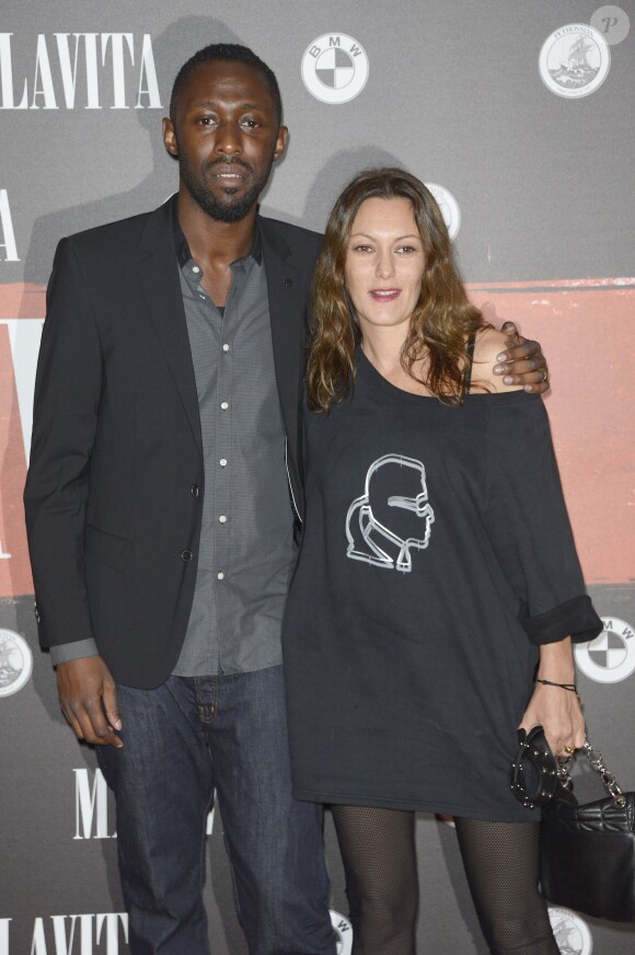 Thomas Ngijol et Karole Rocher lors de l'avant-première du film "Malavita" au Cinéma Europacorp inauguré dans le centre commercial Aéroville autour de Roissy, le 16 octobre 2013