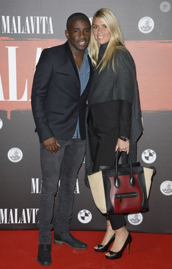 Rio Mavouba et sa femme Elodie lors de l'avant-première du film "Malavita" au Cinéma Europacorp inauguré dans le centre commercial Aéroville autour de Roissy, le 16 octobre 2013