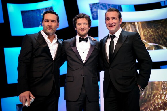 Gilles Lellouche, Guillaume Canet et Jean Dujardin à Paris lors des César le 24 février 2012.