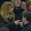 Manuel Valls, son épouse Anne Gravoin, Pierre Moscovici et sa compagne Marie-Charline Pacquot, lors du match France-Nouvelle-Zélande au Stade de France à Saint-Denis le 9 novembre 2013