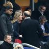 Manuel Valls, sa femme Anne-Gravoin, Pierre Moscovici et sa compagne Marie-Charline Pacquot lors du match entre la France et la Nouvelle-Zélande au Stade de France à Saint-Denis, le 9 novembre 2013