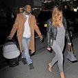 Kanye West, papa stylé en manteau Maison Martin Margiela pour H&amp;M, de sortie à New York avec sa fiancée Kim Kardashian et leur fille North. Le 22 novembre 2013.