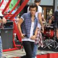 Harry Styles en concert avec le groupe One Direction pour l'émission Today au Rockfeller Center. New York, le 23 août 2013.
