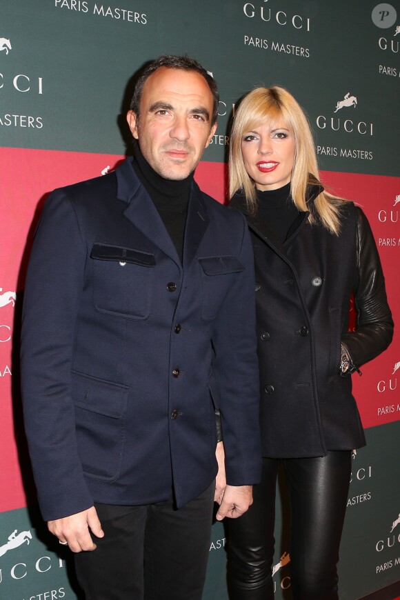 Nikos Aliagas et sa compagne Tina Grigoriou lors de l'épreuve Style & Competition for AMADE aux Gucci Masters de Villepinte le 7 décembre 2013