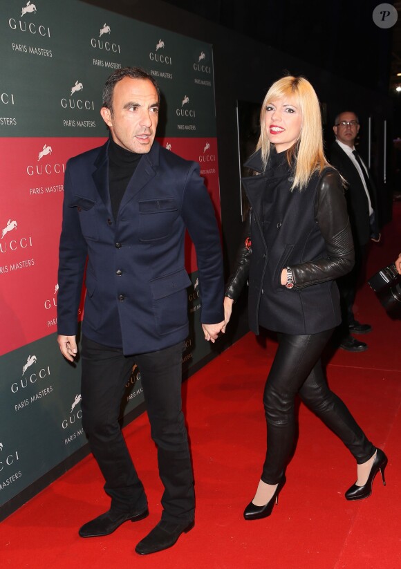 Nikos Aliagas et sa compagne Tina Grigoriou lors de l'épreuve Style & Competition for AMADE aux Gucci Masters de Villepinte le 7 décembre 2013