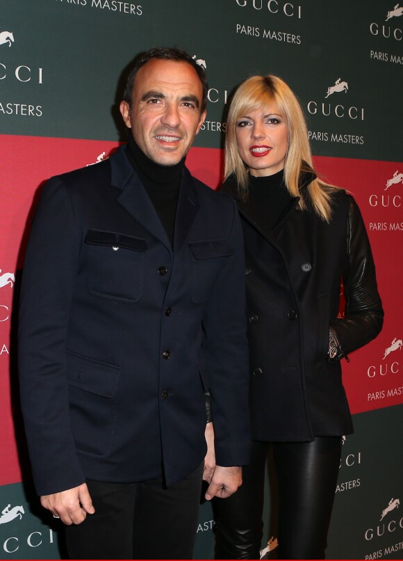 Nikos Aliagas et sa compagne Tina Grigoriou lors de l'épreuve Style & Competition for AMADE aux Gucci Masters de Villepinte le 7 décembre 2013