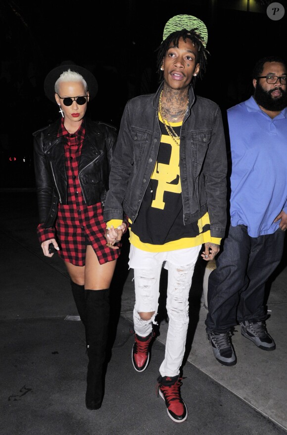 Amber Rose et Wiz Khalifa arrivent au concert de Jay Z au Staples Center de Los Angeles, le 9 décembre 2013.