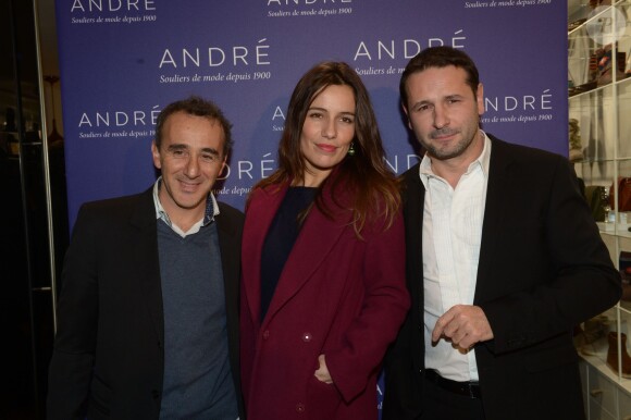 Elie Semoun, Zoé Felix, Lionel Giraud (président d'André) à l'inauguration de la nouvelle boutique "André" à Paris, le 10 décembre 2013.