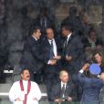 Nicolas Sarkozy et François Hollande au stade de Soccer City à Soweto, le 10 decembre 2013, lors de l'hommage à Nelson Mandela.