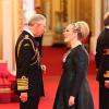 Adele Adkins a été honorée par le prince Charles, du prestigieux titre honorifique de l'Ordre de l'Empire britannique, lors d'une cérémonie à Buckingham Palace, à Londres, le 19 décembre 2013.