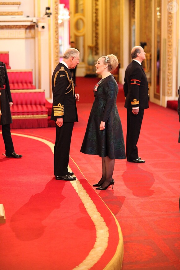 Adele Adkins a été honorée par le prince Charles, du prestigieux titre honorifique de l'Ordre de l'Empire britannique, lors d'une cérémonie à Buckingham Palace, à Londres, le 19 décembre 2013.
