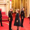 Adele Adkins a été honorée par le prince Charles, du prestigieux titre honorifique de l'Ordre de l'Empire britannique, lors d'une cérémonie à Buckingham Palace, à Londres, le 19 décembre 2013.