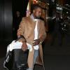 Kanye West tient le landau de sa fille North à New York, le 22 novembre 2013.