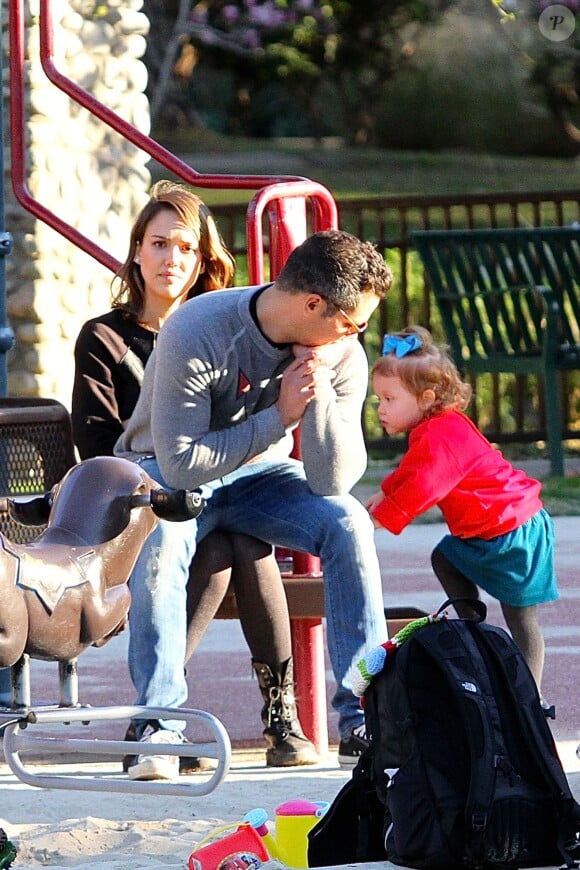 Please hide children's faces prior to the publication - Jessica Alba and Cash Warren take their daughters out for a family day at the park this afternoon, Los Angeles, CA, USA on February 1, 2014. The couple watched Honor play while they stood with their arms wrapped around each other. Jessica recently held a party to celebrate the second anniversary of The Honest Company, which she founded with Chris Gavigan. She paired up with Gavigan, who is the former CEO of Healthy Child Healthy World, which is a nonprofit helping parents to protect their children from toxic risks. Photo by GSI/ABACAPRESS.COM02/02/2014 - Los Angeles