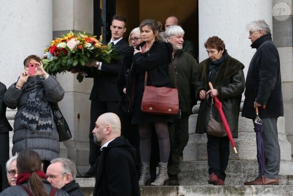 Un des fils de François Cavanna à la sortie des obsèques du dessinateur culte au Père Lachaise à Paris. Le 6 février 2014.