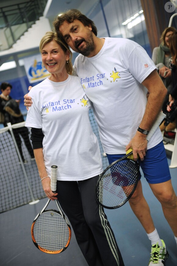 Michèle Laroque et Henri Leconte lors du lancement de l'opération Sourire gagnant de l'association Enfant Star & Match à Levallois-Perret le 10 février 2014