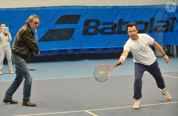 Philippe Lavil et Nicolas Deuil lors du lancement de l'opération Sourire gagnant de l'association Enfant Star & Match à Levallois-Perret le 10 février 2014
