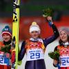 Coline Mattel, aux côtés de la championne olympique Vogt et d'Iraschko, a remporté la médaille de bronze lors de l'épreuve de saut à ski aux Jeux olympiques de Sotchi, le 11 février 2014