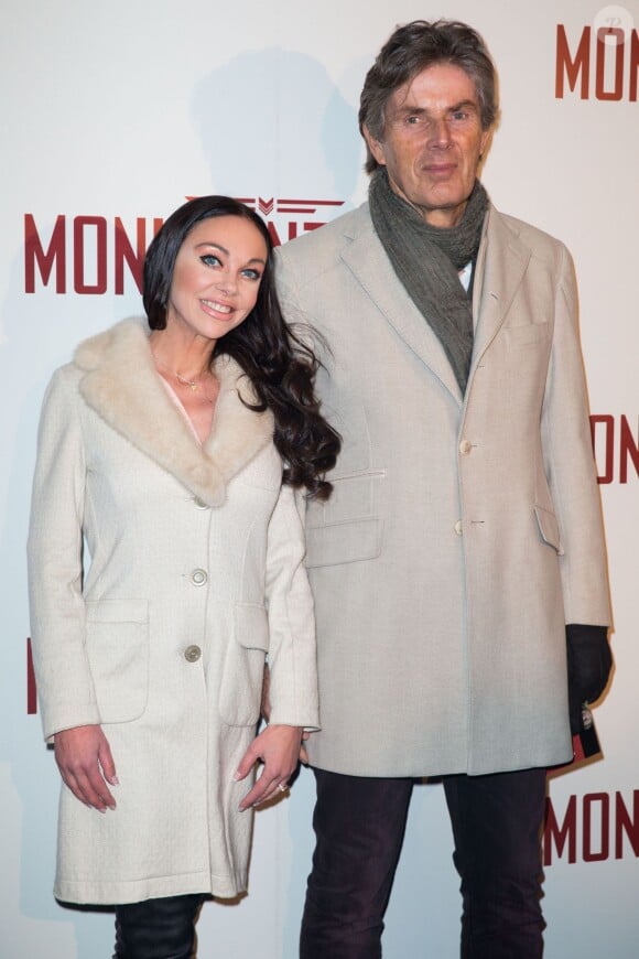Dominique Desseigne et sa compagne Alexandra Cardinale lors de la première du film Monuments Men à l'UGC Normandie à Paris le 12 février 2014.