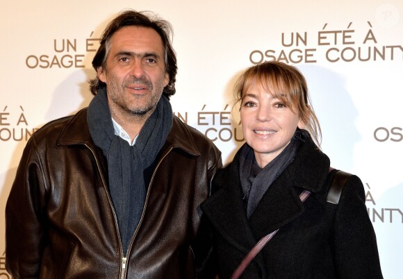 Emmanuel Chain et sa femme Valérie Guignabodet lors de la première du film "Un été à Osage County" à l'UGC Normandie à Paris, le 13 février 2014.