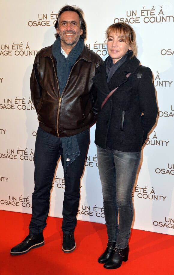 Emmanuel Chain et sa femme Valérie Guignabodet lors de la première du film "Un été à Osage County" à l'UGC Normandie à Paris, le 13 février 2014.