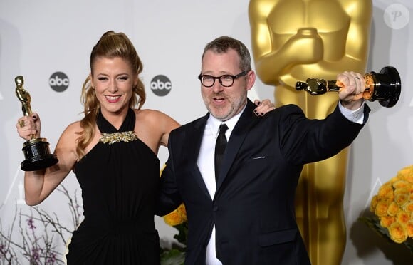 Morgan Neville et Caitrin Rogers (meilleur documentaire) lors de la cérémonie des Oscars le 2 mars 2014