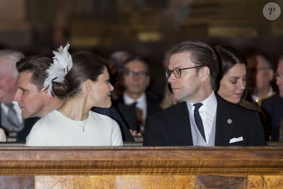 La princesse Victoria et le prince Daniel de Suède à la chapelle royale du palais Drottningholm, à Stockholm, le 2 mars 2014, lors d'une messe pour la naissance de la princesse Leonore, fille de la princesse Madeleine et de Chris O'Neill qui a vu le jour le 20 février à New York.