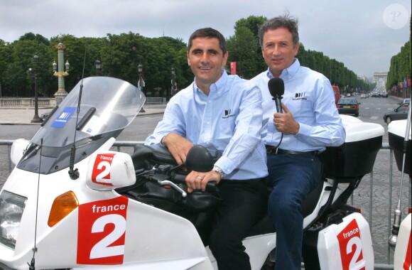 Michel Drucker avec Laurent Jalabert à Paris le 23 juin 2003.